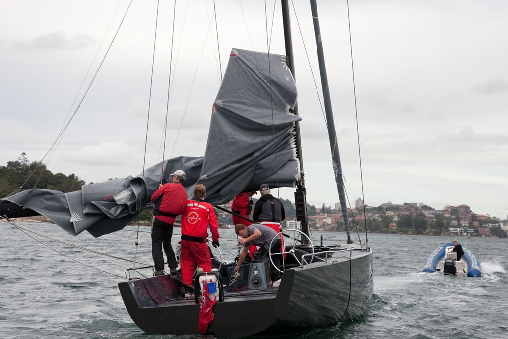 CYCA official keeps an eye on righted Q. - Audi Winter Series 2011 © www.SailPix.com.au http://www.SailPix.com.au